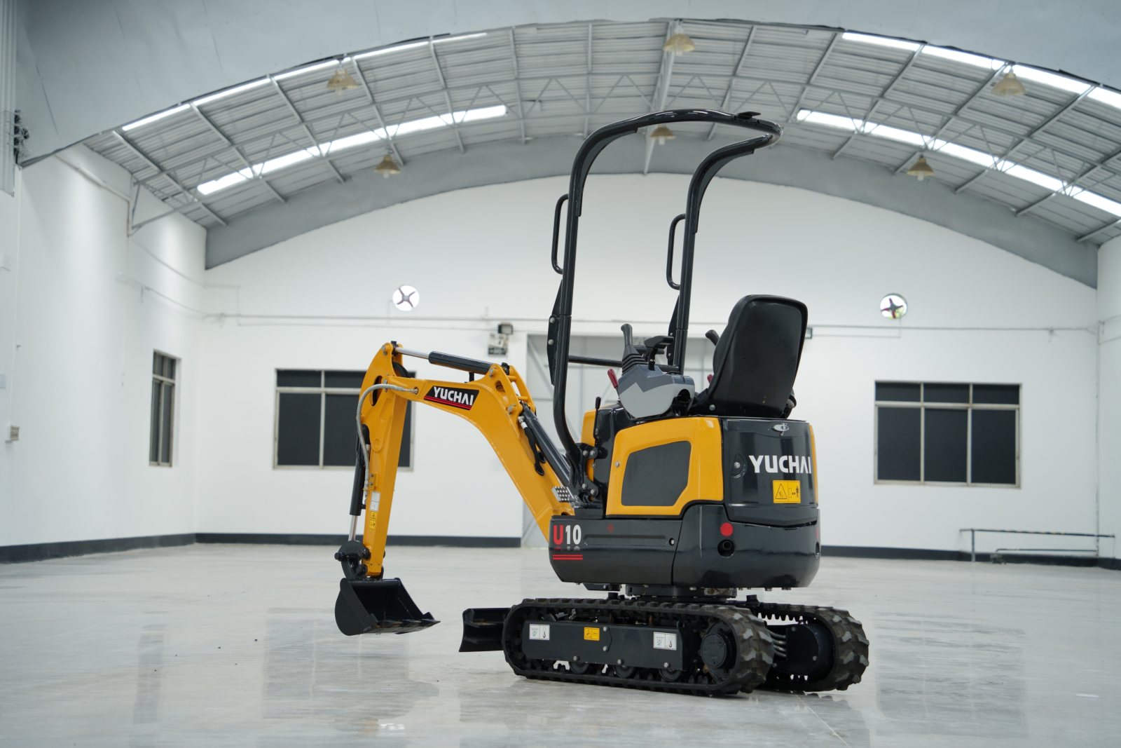 Yuchai compact excavator inside a facility.